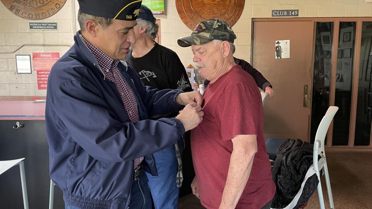 Representative Issa pinning a Veteran